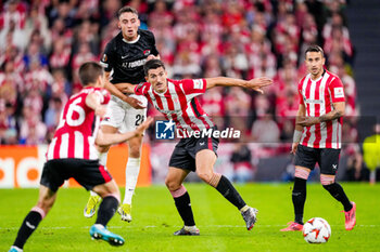 2024-10-03 - Daniel Vivian of Athletic Club battles for possession with Zico Buurmeester of AZ Alkmaar during the UEFA Europa League, League Phase, Matchday 2 football match between Athletic Club and AZ Alkmaar on October 3, 2024 at Estadio de San Mamés in Bilbao, Spain - FOOTBALL - EUROPA LEAGUE - ATHLETIC CLUB V AZ ALKMAAR - UEFA EUROPA LEAGUE - SOCCER