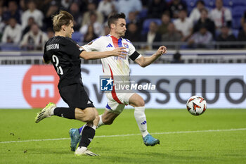 2024-10-24 - Nicolas Tagliafico of Lyon, left Jonas Svensson of Besiktas during the UEFA Europa League, League phase, matchday 3 football match between Olympique Lyonnais (Lyon) and Besiktas JK on 24 October 2024 at Groupama stadium in Decines-Charpieu near Lyon, France - FOOTBALL - EUROPA LEAGUE - LYON V BESIKTAS - UEFA EUROPA LEAGUE - SOCCER