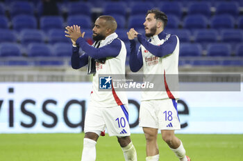 2024-10-24 - Alexandre Lacazette, Rayan Cherki of Lyon salute the supporters following the UEFA Europa League, League phase, matchday 3 football match between Olympique Lyonnais (Lyon) and Besiktas JK on 24 October 2024 at Groupama stadium in Decines-Charpieu near Lyon, France - FOOTBALL - EUROPA LEAGUE - LYON V BESIKTAS - UEFA EUROPA LEAGUE - SOCCER