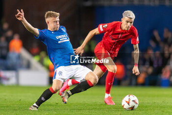 2024-10-24 - Connor Barron of Rangers and Octavian Popescu of FC Steaua Bucharest during the UEFA Europa League, League phase, Matchday 3 football match between Rangers and Steaua Bucharest on 24 October 2024 at Ibrox in Glasgow, Scotland - FOOTBALL - EUROPA LEAGUE - RANGERS V FCSB - UEFA EUROPA LEAGUE - SOCCER