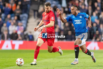 2024-10-24 - Mihai Popescu of FC Steaua Bucharest and Zakariya Lovelace of Rangers during the UEFA Europa League, League phase, Matchday 3 football match between Rangers and Steaua Bucharest on 24 October 2024 at Ibrox in Glasgow, Scotland - FOOTBALL - EUROPA LEAGUE - RANGERS V FCSB - UEFA EUROPA LEAGUE - SOCCER