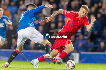 2024-10-24 - Daniel Birligea of FC Steaua Bucharest and Robin Propper of Rangers during the UEFA Europa League, League phase, Matchday 3 football match between Rangers and Steaua Bucharest on 24 October 2024 at Ibrox in Glasgow, Scotland - FOOTBALL - EUROPA LEAGUE - RANGERS V FCSB - UEFA EUROPA LEAGUE - SOCCER