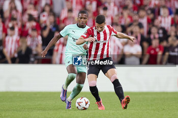 2024-10-24 - Simion Michez of SK Slavia Prague competes for the ball with Gorka Guruzeta of Athletic Club during the UEFA Europa League, League phase, Matchday 3 football match between Athletic Club and SK Slavia Praha on October 24, 2024 at San Mames in Bilbao, Spain - FOOTBALL - EUROPA LEAGUE - ATHLETIC CLUB V SLAVIA PRAHA - UEFA EUROPA LEAGUE - SOCCER