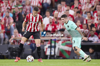 2024-10-24 - Gorka Guruzeta of Athletic Club and Christos Zafeiris of SK Slavia Praha during the UEFA Europa League, League phase, Matchday 3 football match between Athletic Club and SK Slavia Praha on October 24, 2024 at San Mames in Bilbao, Spain - FOOTBALL - EUROPA LEAGUE - ATHLETIC CLUB V SLAVIA PRAHA - UEFA EUROPA LEAGUE - SOCCER