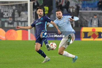 2024-11-07 - Lazio’s Mario Gila and Porto’s Fabio Vieira during the UEFA Europa League 2024-2025  football match between SS Lazio and FC Porto at the Olympic Stadium in Rome on November 07, 2024. - SS LAZIO VS FC PORTO - UEFA EUROPA LEAGUE - SOCCER