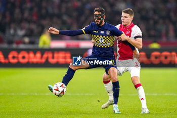 2024-11-07 - Sagiv Jehezkel of Maccabi Tel Aviv and Anton Gaaei of AFC Ajax during the UEFA Europa League, League Phase, MD4 football match between AFC Ajax and Maccabi Tel Aviv on November 7, 2024 at Johan Cruijff ArenA in Amsterdam, Netherlands - FOOTBALL - EUROPA LEAGUE - AJAX V MACCABI TEL AVIV - UEFA EUROPA LEAGUE - SOCCER