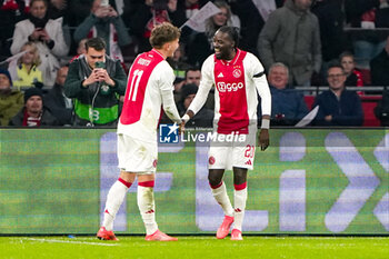 2024-11-07 - Betrand Traore of AFC Ajax celebrates his goal 1-0 with Mika Godts during the UEFA Europa League, League Phase, MD4 football match between AFC Ajax and Maccabi Tel Aviv on November 7, 2024 at Johan Cruijff ArenA in Amsterdam, Netherlands - FOOTBALL - EUROPA LEAGUE - AJAX V MACCABI TEL AVIV - UEFA EUROPA LEAGUE - SOCCER