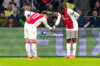 2024-11-07 - Betrand Traore of AFC Ajax celebrates his goal 1-0 with Mika Godts during the UEFA Europa League, League Phase, MD4 football match between AFC Ajax and Maccabi Tel Aviv on November 7, 2024 at Johan Cruijff ArenA in Amsterdam, Netherlands - FOOTBALL - EUROPA LEAGUE - AJAX V MACCABI TEL AVIV - UEFA EUROPA LEAGUE - SOCCER