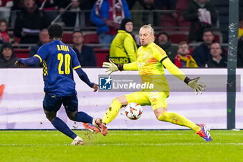 2024-11-07 - Henry Addo of Maccabi Tel Aviv, Goalkeeper Remko Pasveer of AFC Ajax during the UEFA Europa League, League Phase, MD4 football match between AFC Ajax and Maccabi Tel Aviv on November 7, 2024 at Johan Cruijff ArenA in Amsterdam, Netherlands - FOOTBALL - EUROPA LEAGUE - AJAX V MACCABI TEL AVIV - UEFA EUROPA LEAGUE - SOCCER