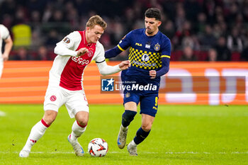 2024-11-07 - Christian Rasmussen of AFC Ajax battles for possession with Dor Turgeman of Maccabi Tel Aviv during the UEFA Europa League, League Phase, MD4 football match between AFC Ajax and Maccabi Tel Aviv on November 7, 2024 at Johan Cruijff ArenA in Amsterdam, Netherlands - FOOTBALL - EUROPA LEAGUE - AJAX V MACCABI TEL AVIV - UEFA EUROPA LEAGUE - SOCCER