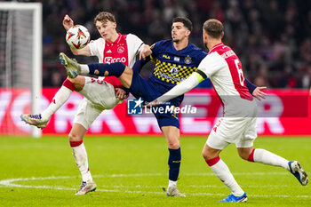 2024-11-07 - Youri Baas of AFC Ajax battles for possession with Dor Turgeman of Maccabi Tel Aviv during the UEFA Europa League, League Phase, MD4 football match between AFC Ajax and Maccabi Tel Aviv on November 7, 2024 at Johan Cruijff ArenA in Amsterdam, Netherlands - FOOTBALL - EUROPA LEAGUE - AJAX V MACCABI TEL AVIV - UEFA EUROPA LEAGUE - SOCCER