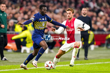 2024-11-07 - Henry Addo of Maccabi Tel Aviv battles for possession with Daniele Rugani of AFC Ajax during the UEFA Europa League, League Phase, MD4 football match between AFC Ajax and Maccabi Tel Aviv on November 7, 2024 at Johan Cruijff ArenA in Amsterdam, Netherlands - FOOTBALL - EUROPA LEAGUE - AJAX V MACCABI TEL AVIV - UEFA EUROPA LEAGUE - SOCCER