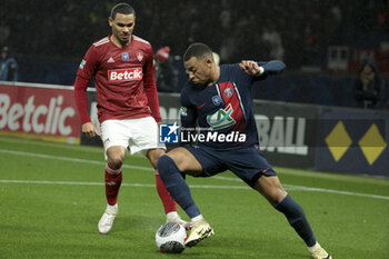 2024-02-07 - Kylian Mbappe of PSG, left Kenny Lala of Brest during the French Cup, round of 16 football match between Paris Saint-Germain (PSG) and Stade Brestois 29 (Brest) on February 7, 2024 at Parc des Princes stadium in Paris, France - FOOTBALL - FRENCH CUP - PARIS SG V BREST - FRENCH CUP - SOCCER