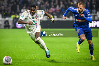 2024-02-27 - Ernest NUAMAH of Lyon and Thomas DELAINE of Strasbourg during the French Cup, Quarter-Finals football match between Olympique Lyonnais (Lyon) and RC Strasbourg on February 27, 2024 at Groupama stadium in Decines-Charpieu near Lyon, France - FOOTBALL - FRENCH CUP - LYON V STRASBOURG - FRENCH CUP - SOCCER