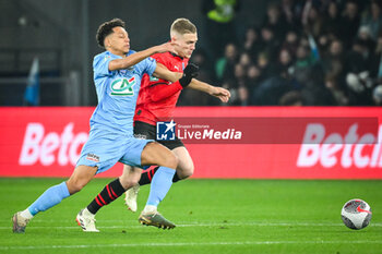 2024-02-29 - Tommy IVA of Le Puy and Adrien TRUFFERT of Rennes during the French Cup, Quarter-Finals football match between Le Puy Foot 43 Auvergne and Stade Rennais (Rennes) on February 29, 2024 at Geoffroy Guichard stadium in Saint-Étienne, France - FOOTBALL - FRENCH CUP - LE PUY V RENNES - FRENCH CUP - SOCCER