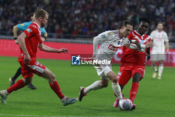 2024-04-02 - Maxence CAQUERET of Lyon and Jean Eric MOURSOU of Valenciennes and Julien MASSON of Valenciennes during the French Cup, Semi-final football match between Olympique Lyonnais and Valenciennes FC on April 2, 2024 at Groupama stadium in Decines-Charpieu near Lyon, France - FOOTBALL - FRENCH CUP - LYON V VALENCIENNES - FRENCH CUP - SOCCER