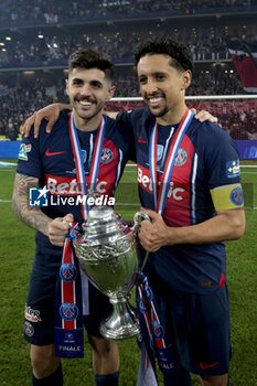 2024-05-25 - Lucas Beraldo and Marquinhos of PSG celebrate the victory following the French Cup Final football match between Olympique Lyonnais (OL, Lyon) and Paris Saint-Germain (PSG) on May 25, 2024 at Stade Pierre Mauroy, Decathlon Arena in Villeneuve-d'Ascq near Lille, France - FOOTBALL - FRENCH CUP - FINAL - LYON V PARIS SG - FRENCH CUP - SOCCER