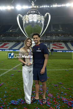 2024-05-25 - Marquinhos of PSG and Carol Cabrino celebrate the victory following the French Cup Final football match between Olympique Lyonnais (OL, Lyon) and Paris Saint-Germain (PSG) on May 25, 2024 at Stade Pierre Mauroy, Decathlon Arena in Villeneuve-d'Ascq near Lille, France - FOOTBALL - FRENCH CUP - FINAL - LYON V PARIS SG - FRENCH CUP - SOCCER