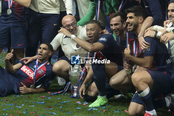 2024-05-25 - Achraf Hakimi, Kylian Mbappe, Fabian Ruiz Pena, Marco Asensio of PSG and teammates celebrate during the podium ceremony following the French Cup Final football match between Olympique Lyonnais (OL, Lyon) and Paris Saint-Germain (PSG) on May 25, 2024 at Stade Pierre Mauroy, Decathlon Arena in Villeneuve-d'Ascq near Lille, France - FOOTBALL - FRENCH CUP - FINAL - LYON V PARIS SG - FRENCH CUP - SOCCER