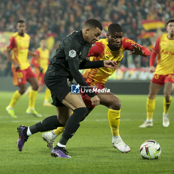 2024-01-14 - Kylian Mbappe of PSG, Kevin Danso of Lens during the French championship Ligue 1 football match between RC Lens and Paris Saint-Germain on January 14, 2024 at Stade Bollaert-Delelis in Lens, France - FOOTBALL - FRENCH CHAMP - LENS V PARIS SG - FRENCH LIGUE 1 - SOCCER