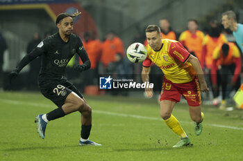 2024-01-14 - Bradley Barcola of PSG, Przemyslaw Frankowski of Lens during the French championship Ligue 1 football match between RC Lens and Paris Saint-Germain on January 14, 2024 at Stade Bollaert-Delelis in Lens, France - FOOTBALL - FRENCH CHAMP - LENS V PARIS SG - FRENCH LIGUE 1 - SOCCER