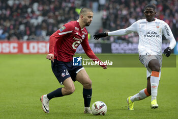 2024-01-14 - Edon Zhegrova of Lille, Ayman Kari of Lorient during the French championship Ligue 1 football match between Losc Lille and FC Lorient on January 14, 2024 at Decathlon Arena Stade Pierre Mauroy in Villeneuve-d'Ascq, France - FOOTBALL - FRENCH CHAMP - LILLE V LORIENT - FRENCH LIGUE 1 - SOCCER