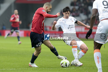 2024-01-14 - Edon Zhegrova of Lille, Laurent Abergel of Lorient during the French championship Ligue 1 football match between Losc Lille and FC Lorient on January 14, 2024 at Decathlon Arena Stade Pierre Mauroy in Villeneuve-d'Ascq, France - FOOTBALL - FRENCH CHAMP - LILLE V LORIENT - FRENCH LIGUE 1 - SOCCER