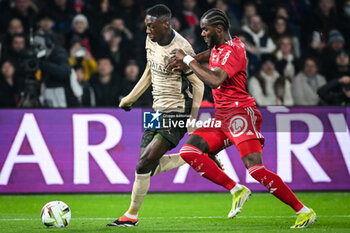 2024-01-28 - Randal KOLO MUANI of PSG and Bradley LOCKO of Brest during the French championship Ligue 1 football match between Paris Saint-Germain and Stade Brestois (Brest) on January 28, 2024 at Parc des Princes stadium in Paris, France - FOOTBALL - FRENCH CHAMP - PARIS SG V BREST - FRENCH LIGUE 1 - SOCCER