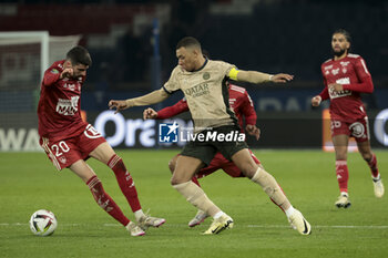 2024-01-28 - Kylian Mbappe of PSG, left Pierre Lees-Melou of Brest during the French championship Ligue 1 football match between Paris Saint-Germain and Stade Brestois (Brest) on January 28, 2024 at Parc des Princes stadium in Paris, France - FOOTBALL - FRENCH CHAMP - PARIS SG V BREST - FRENCH LIGUE 1 - SOCCER