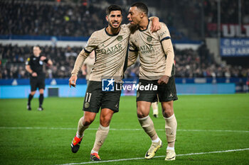 2024-02-02 - Kylian MBAPPE of PSG celebrate his goal with Marco ASENSIO of PSG during the French championship Ligue 1 football match between RC Strasbourg and Paris Saint-Germain on February 2, 2024 at La Meinau stadium in Strasbourg, France - FOOTBALL - FRENCH CHAMP - STRASBOURG V PARIS SG - FRENCH LIGUE 1 - SOCCER