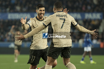 2024-02-02 - Kylian Mbappe of PSG celebrates his goal with Marco Asensio (left) during the French championship Ligue 1 football match between RC Strasbourg and Paris Saint-Germain on February 2, 2024 at Stade de La Meinau in Strasbourg, France - FOOTBALL - FRENCH CHAMP - STRASBOURG V PARIS SG - FRENCH LIGUE 1 - SOCCER