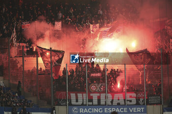2024-02-02 - Flares from supporters of PSG during the French championship Ligue 1 football match between RC Strasbourg and Paris Saint-Germain on February 2, 2024 at Stade de La Meinau in Strasbourg, France - FOOTBALL - FRENCH CHAMP - STRASBOURG V PARIS SG - FRENCH LIGUE 1 - SOCCER