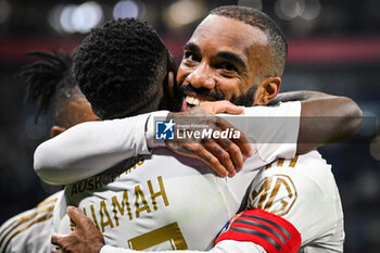 2024-02-04 - Alexandre LACAZETTE of Lyon celebrate his goal with Ernest NUAMAH of Lyon during the French championship Ligue 1 football match between Olympique Lyonnais (Lyon) and Olympique de Marseille on February 4, 2024 at Groupama Stadium in Décines-Charpieu near Lyon, France - FOOTBALL - FRENCH CHAMP - LYON V MARSEILLE - FRENCH LIGUE 1 - SOCCER