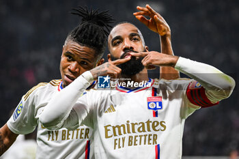 2024-02-04 - Alexandre LACAZETTE of Lyon celebrate his goal with Gift ORBAN of Lyon during the French championship Ligue 1 football match between Olympique Lyonnais (Lyon) and Olympique de Marseille on February 4, 2024 at Groupama Stadium in Décines-Charpieu near Lyon, France - FOOTBALL - FRENCH CHAMP - LYON V MARSEILLE - FRENCH LIGUE 1 - SOCCER
