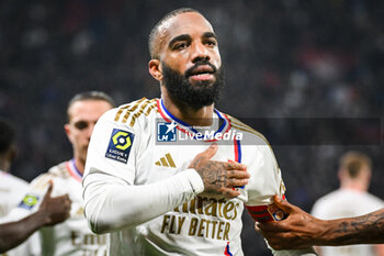 2024-02-04 - Alexandre LACAZETTE of Lyon celebrates his goal during the French championship Ligue 1 football match between Olympique Lyonnais (Lyon) and Olympique de Marseille on February 4, 2024 at Groupama Stadium in Décines-Charpieu near Lyon, France - FOOTBALL - FRENCH CHAMP - LYON V MARSEILLE - FRENCH LIGUE 1 - SOCCER