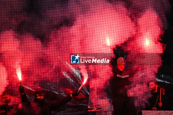 2024-02-04 - Supporters of Lyon using smoke bombs during the French championship Ligue 1 football match between Olympique Lyonnais (Lyon) and Olympique de Marseille on February 4, 2024 at Groupama Stadium in Décines-Charpieu near Lyon, France - FOOTBALL - FRENCH CHAMP - LYON V MARSEILLE - FRENCH LIGUE 1 - SOCCER