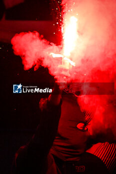2024-02-10 - A PSG supporter uses a smoke bomb during the French championship Ligue 1 football match between Paris Saint-Germain and Losc Lille on February 10, 2024 at Parc des Princes stadium in Paris, France - FOOTBALL - FRENCH CHAMP - PARIS SG V LILLE - FRENCH LIGUE 1 - SOCCER