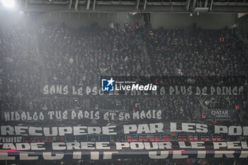 2024-02-10 - Supporters of PSG unveil banners in the stands which read "Without PSG the Parc has no more Prince" and "Hidalgo kills Paris and it's magic" during the French championship Ligue 1 football match between Paris Saint-Germain and Losc Lille on February 10, 2024 at Parc des Princes stadium in Paris, France - FOOTBALL - FRENCH CHAMP - PARIS SG V LILLE - FRENCH LIGUE 1 - SOCCER