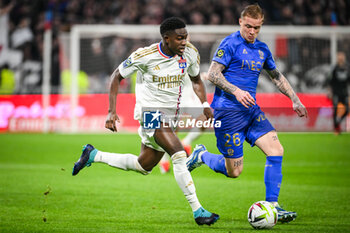 2024-02-16 - Ernest NUAMAH of Lyon and Melvin BARB of Nice during the French championship Ligue 1 football match between Olympique Lyonnais (Lyon) and OGC Nice on February 16, 2024 at Groupama stadium in Decines-Charpieu near Lyon, France - FOOTBALL - FRENCH CHAMP - LYON V NICE - FRENCH LIGUE 1 - SOCCER