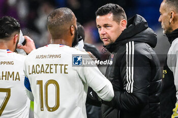 2024-02-16 - Alexandre LACAZETTE of Lyon and Pierre SAGE of Lyon during the French championship Ligue 1 football match between Olympique Lyonnais (Lyon) and OGC Nice on February 16, 2024 at Groupama stadium in Decines-Charpieu near Lyon, France - FOOTBALL - FRENCH CHAMP - LYON V NICE - FRENCH LIGUE 1 - SOCCER