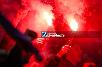 2024-02-16 - Supporters of Lyon using smoke bombs during the French championship Ligue 1 football match between Olympique Lyonnais (Lyon) and OGC Nice on February 16, 2024 at Groupama stadium in Decines-Charpieu near Lyon, France - FOOTBALL - FRENCH CHAMP - LYON V NICE - FRENCH LIGUE 1 - SOCCER