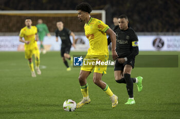 2024-02-17 - Nathan Zeze of Nante, Kylian Mbappe of PSG during the French championship Ligue 1 football match between FC Nantes and Paris Saint-Germain on February 17, 2024 at La Beaujoire - Louis Fonteneau stadium in Nantes, France - FOOTBALL - FRENCH CHAMP - NANTES V PARIS SG - FRENCH LIGUE 1 - SOCCER
