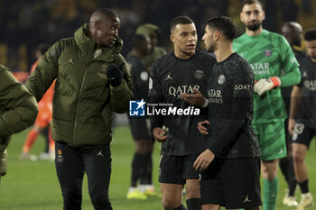 2024-02-17 - Nordi Mukiele, Kylian Mbappe, Achraf Hakimi of PSG celebrate the victory following the French championship Ligue 1 football match between FC Nantes and Paris Saint-Germain on February 17, 2024 at La Beaujoire - Louis Fonteneau stadium in Nantes, France - FOOTBALL - FRENCH CHAMP - NANTES V PARIS SG - FRENCH LIGUE 1 - SOCCER