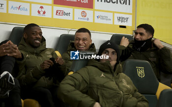 2024-02-17 - Ousmane Dembele, Kylian Mbappe, Achraf Hakimi of PSG on the bench during the French championship Ligue 1 football match between FC Nantes and Paris Saint-Germain on February 17, 2024 at La Beaujoire - Louis Fonteneau stadium in Nantes, France - FOOTBALL - FRENCH CHAMP - NANTES V PARIS SG - FRENCH LIGUE 1 - SOCCER