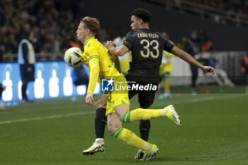 2024-02-17 - Nicolas Cozza of Nantes, Warren Zaire-Emery of PSG during the French championship Ligue 1 football match between FC Nantes and Paris Saint-Germain on February 17, 2024 at La Beaujoire - Louis Fonteneau stadium in Nantes, France - FOOTBALL - FRENCH CHAMP - NANTES V PARIS SG - FRENCH LIGUE 1 - SOCCER