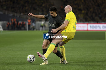 2024-02-17 - Warren Zaire-Emery of PSG, Nicolas Pallois of Nantes during the French championship Ligue 1 football match between FC Nantes and Paris Saint-Germain on February 17, 2024 at La Beaujoire - Louis Fonteneau stadium in Nantes, France - FOOTBALL - FRENCH CHAMP - NANTES V PARIS SG - FRENCH LIGUE 1 - SOCCER