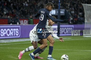 2024-02-25 - Bradley Barcola of PSG, Guela Doue of Rennes during the French championship Ligue 1 football match between Paris Saint-Germain and Stade Rennais (Rennes) on February 25, 2024 at Parc des Princes stadium in Paris, France - FOOTBALL - FRENCH CHAMP - PARIS SG V RENNES - FRENCH LIGUE 1 - SOCCER