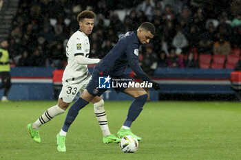 2024-02-25 - Kylian Mbappe of PSG, left Desire Doue of Rennes during the French championship Ligue 1 football match between Paris Saint-Germain and Stade Rennais (Rennes) on February 25, 2024 at Parc des Princes stadium in Paris, France - FOOTBALL - FRENCH CHAMP - PARIS SG V RENNES - FRENCH LIGUE 1 - SOCCER