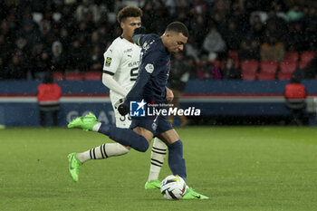 2024-02-25 - Kylian Mbappe of PSG, left Desire Doue of Rennes during the French championship Ligue 1 football match between Paris Saint-Germain and Stade Rennais (Rennes) on February 25, 2024 at Parc des Princes stadium in Paris, France - FOOTBALL - FRENCH CHAMP - PARIS SG V RENNES - FRENCH LIGUE 1 - SOCCER