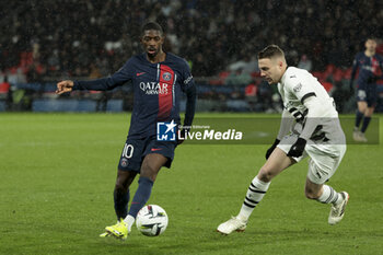 2024-02-25 - Ousmane Dembele of PSG, Adrien Truffert of Rennes during the French championship Ligue 1 football match between Paris Saint-Germain and Stade Rennais (Rennes) on February 25, 2024 at Parc des Princes stadium in Paris, France - FOOTBALL - FRENCH CHAMP - PARIS SG V RENNES - FRENCH LIGUE 1 - SOCCER